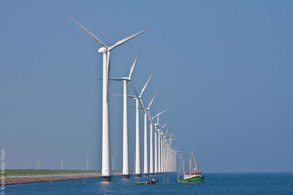 Windmills and fishing ship © Kruwt / Adobe Stock