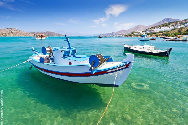 Fishing boats at the coast of Crete, Greece © Patryk Kosmider / Adobe Stock